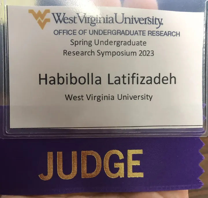 Official judge badge for Habibolla Latifizadeh at the WVU Spring Undergraduate Research Symposium, 2023