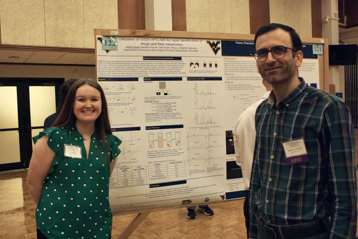Habib Latifizadeh discussing a student research poster